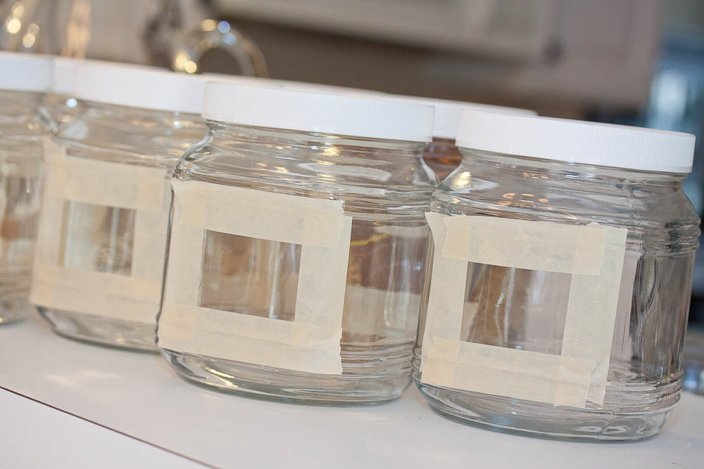 glass jars with a rectangle outlined in masking tape