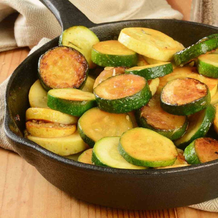 Sautéed yellow squash and zucchini in a cast iron skillet.