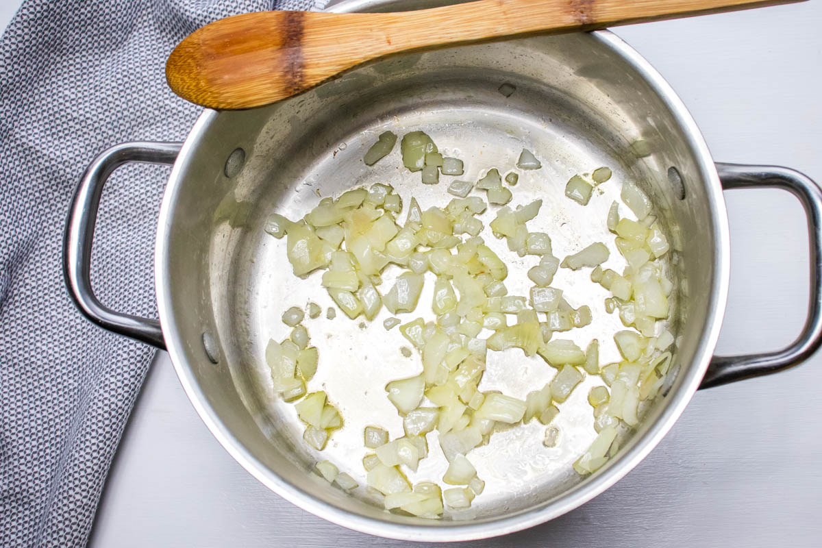 Chopped onion sautéed in oil in a soup pot.