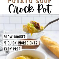 Crock of cheesy potato soup garnished with shredded cheddar cheese and sliced green onion with a spoonful held above the crock and text Cheesy Potato Soup Crock pot - Slow cooker, 5 quick ingredients, easy prep.